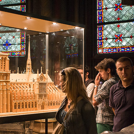 people looking at a model of the building they are standing in