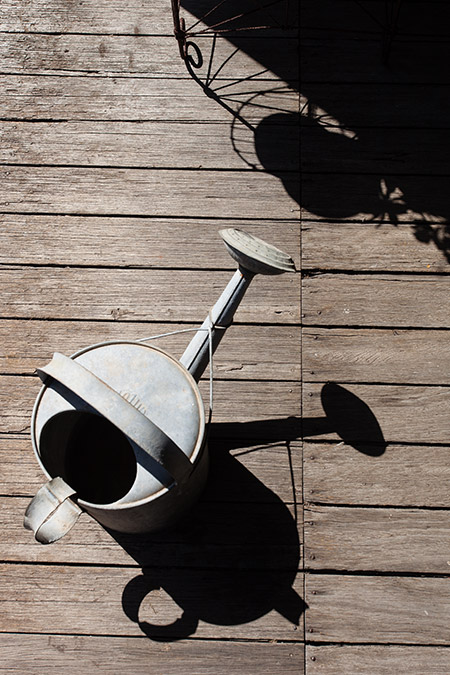a watering can on the back verandah