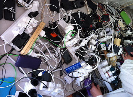 A jumble of cables and phones
