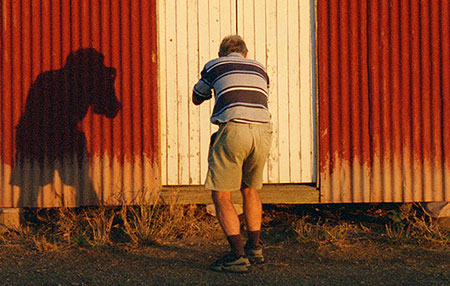 Thom photographing shed at Oondooroo railway siding